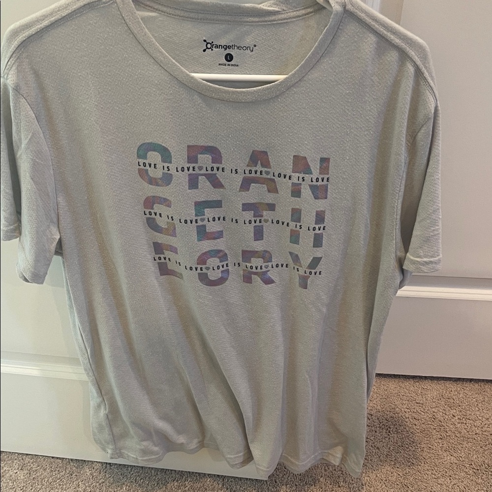 Orangetheory Light Gray Tee with Multicolor Text “Love is Love”